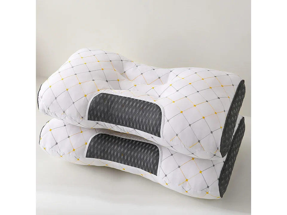 White ergonomic neck support pillow with quilted pattern.