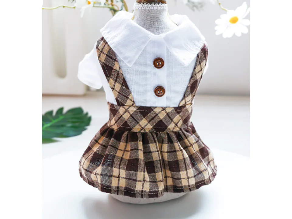 A brown plaid pet dress with a white collared shirt top on a mannequin.