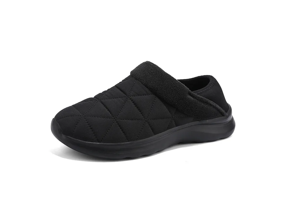 Black quilted indoor slipper with a thick sole.
