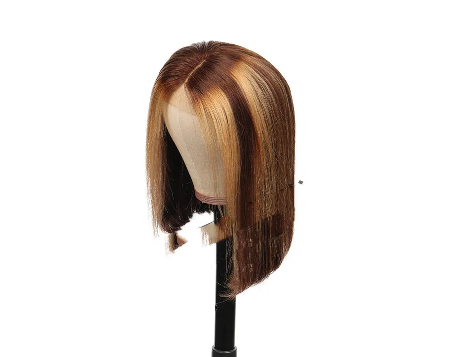 A short, straight, highlighted bob wig on a mannequin head, viewed from the front.