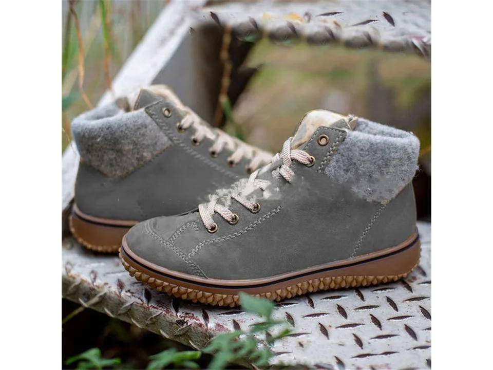 Grey lace-up snow boots with a grey wool cuff and thick brown sole.