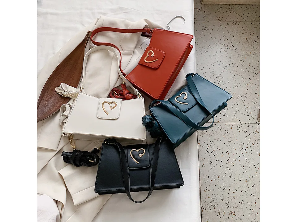 Four small square shoulder bags in red, white, blue, and black arranged together.