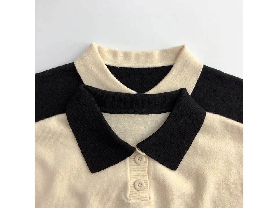 Close-up of the sweater collar and button placket.