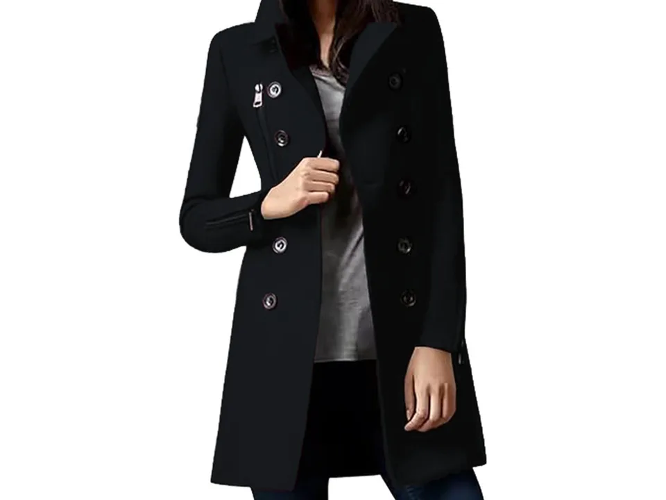A woman wearing a black double-breasted coat.