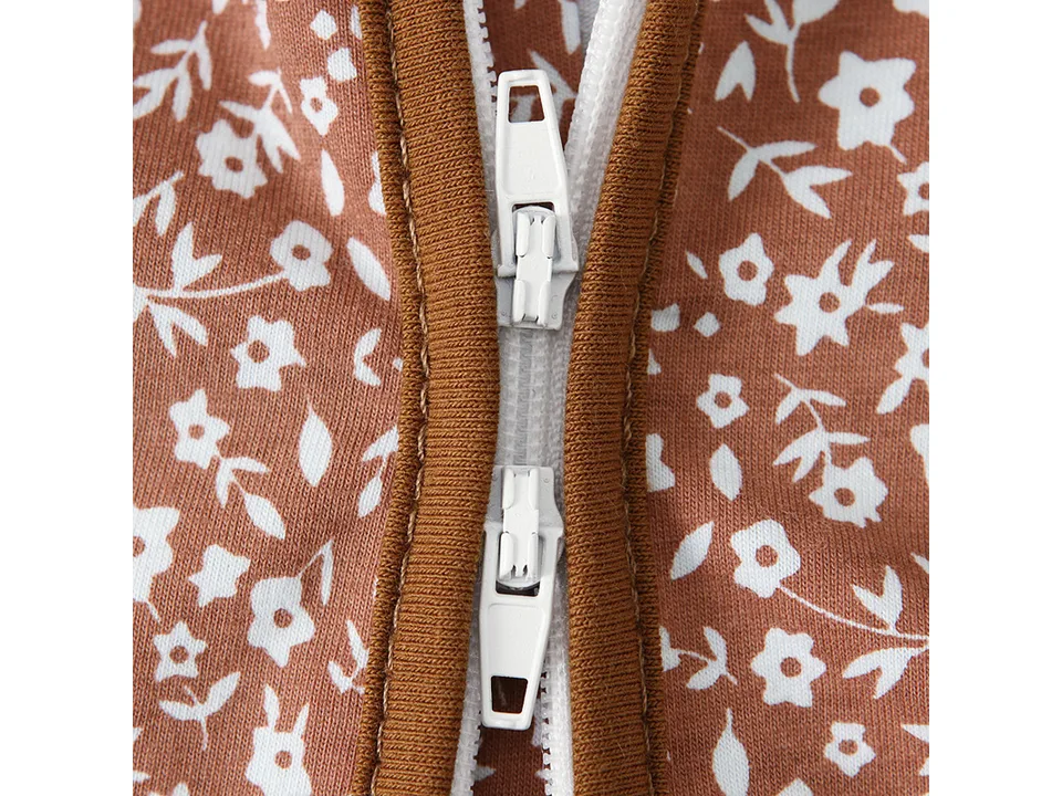 Close-up of the zipper mechanism on the baby jumpsuit.