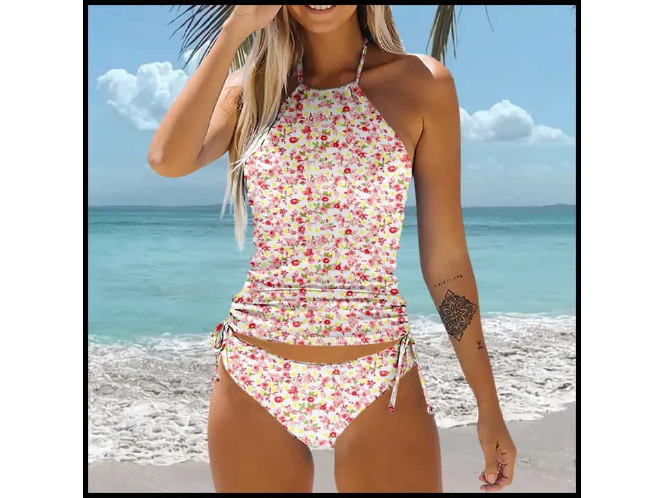 A woman wearing a red and yellow floral high-waisted bikini set with a halter neck top.