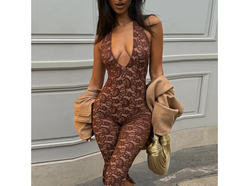 Front view of a woman wearing a brown lace halter bodycon jumpsuit with a jacket.