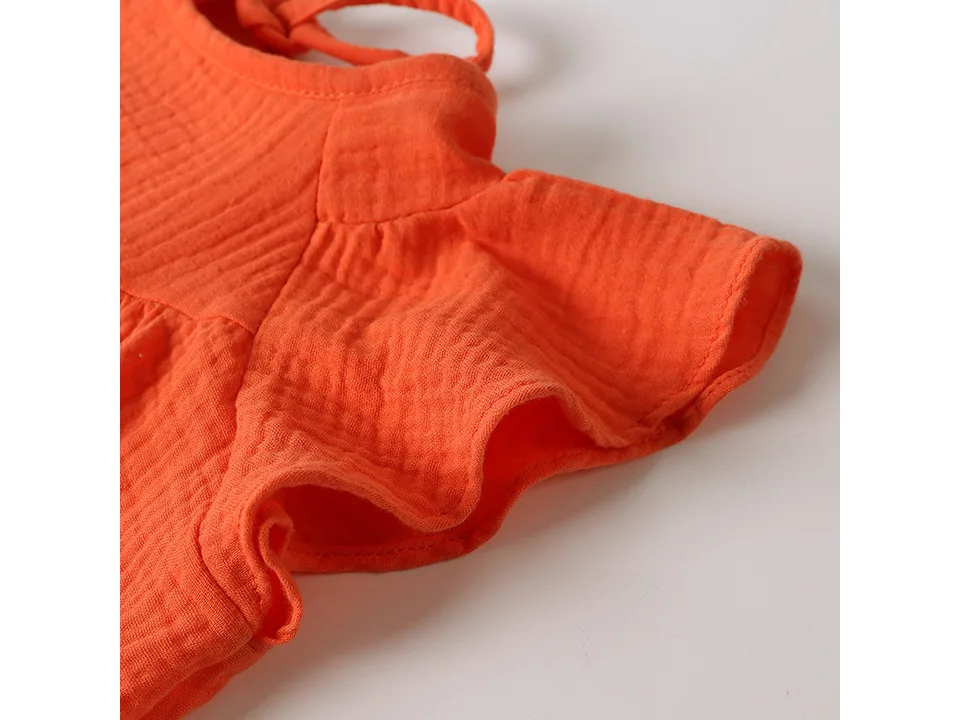 Close-up of the flutter sleeve detail on the dress