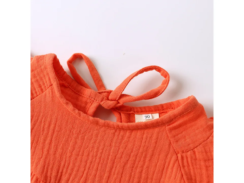 Close-up of the dress neckline and size tag
