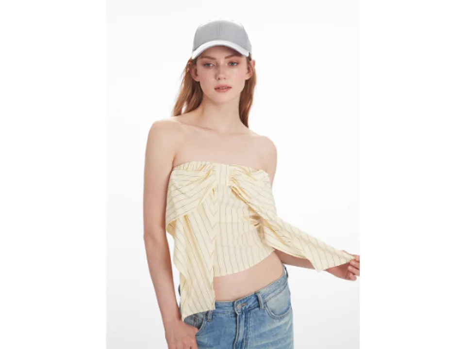 Close-up of the striped strapless tube top with a bow detail.
