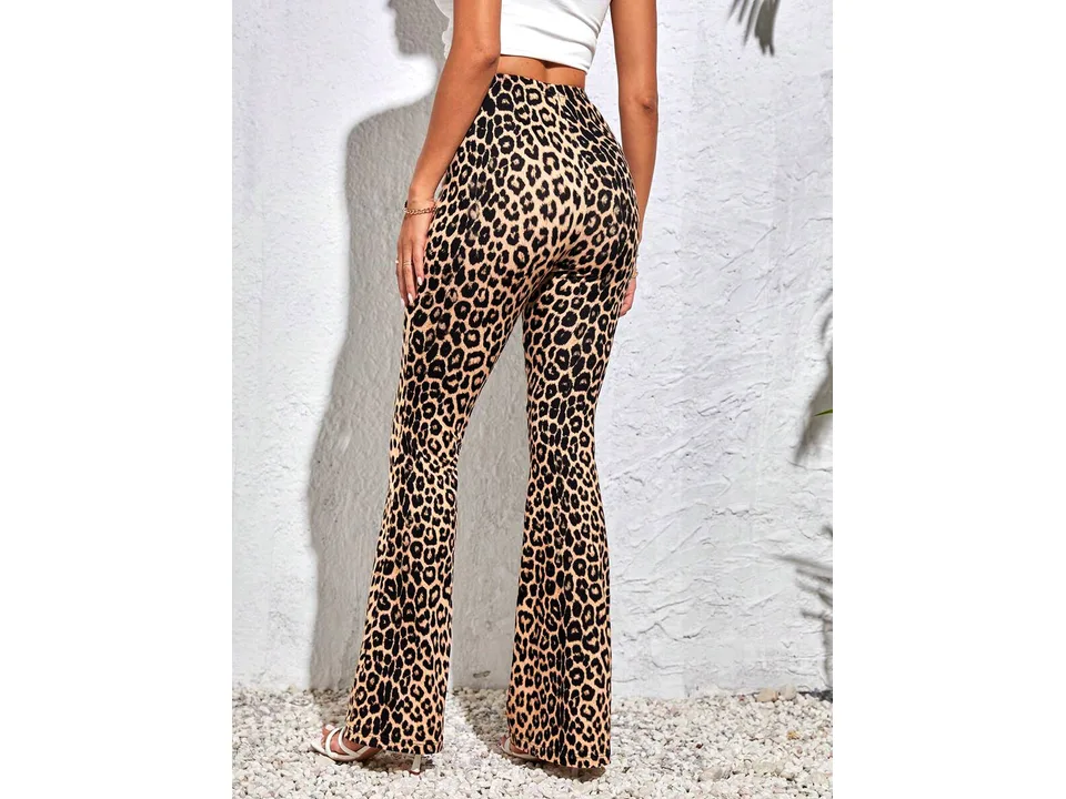 Model wearing high-waisted leopard print flare trousers, back view.
