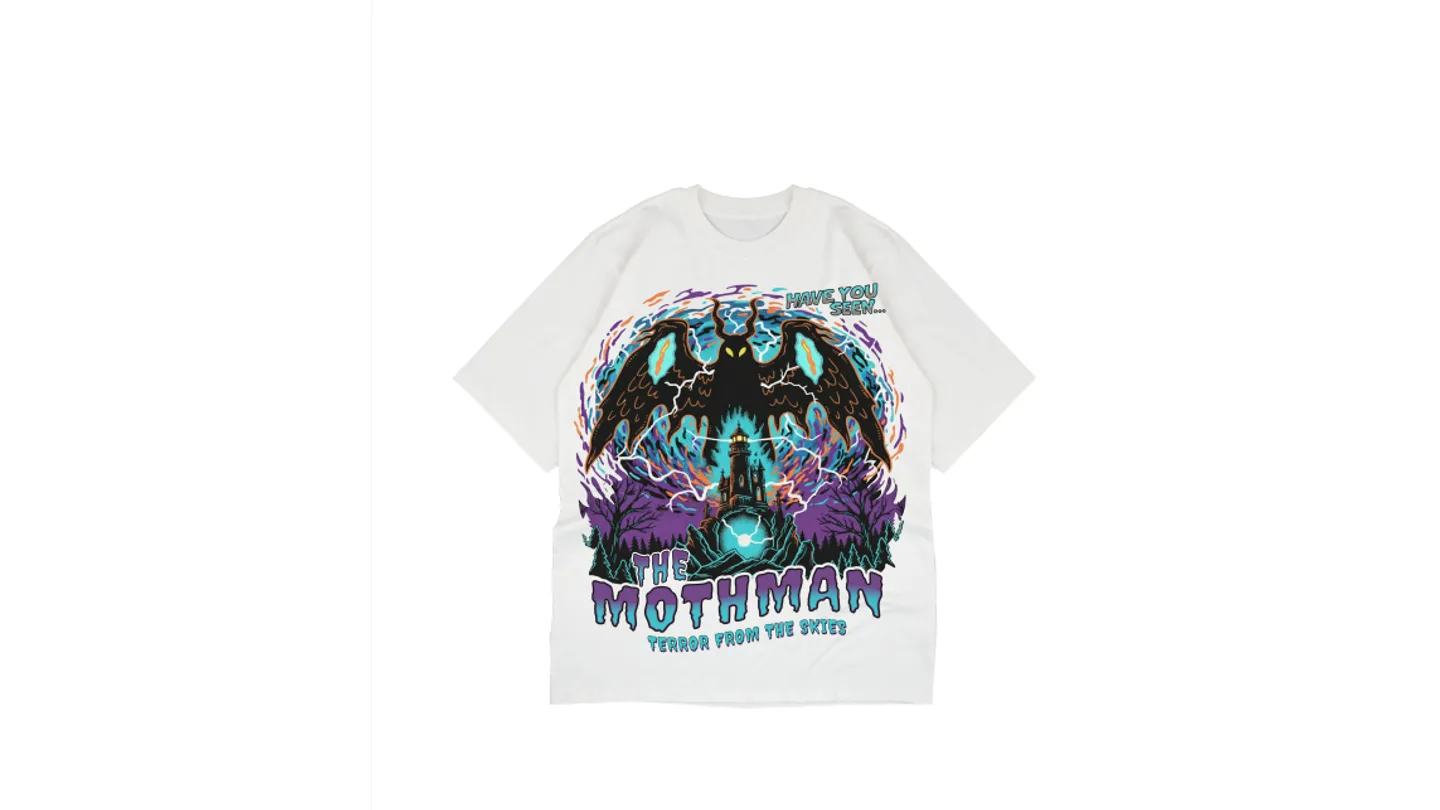 White t-shirt with a Mothman graphic print featuring a lighthouse and lightning.