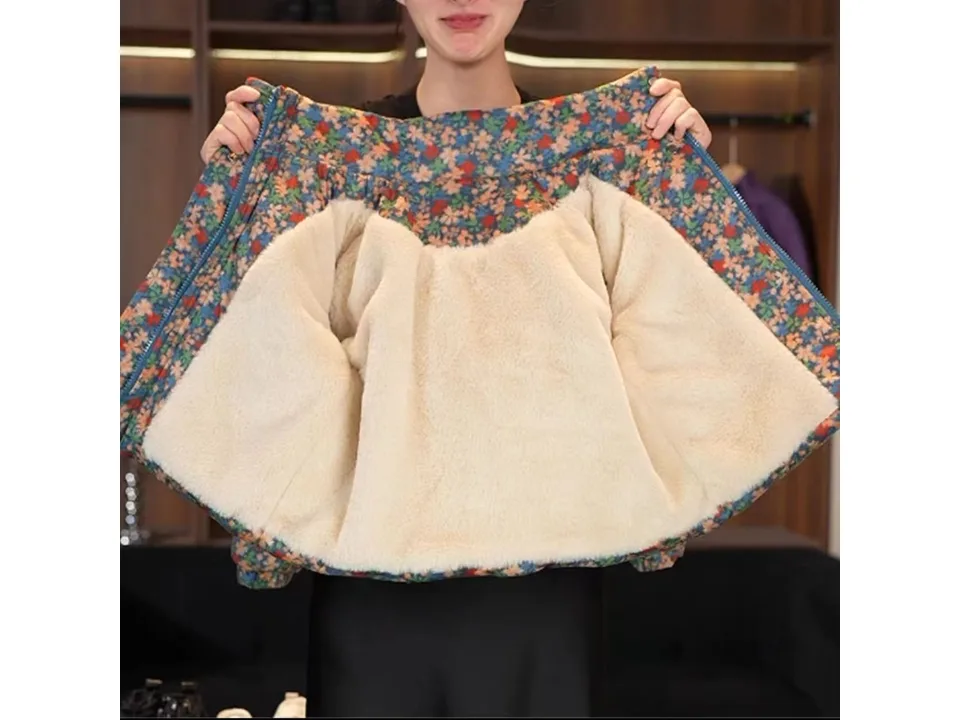 The floral winter coat opened up to reveal the thick, cream-colored faux fur lining inside.