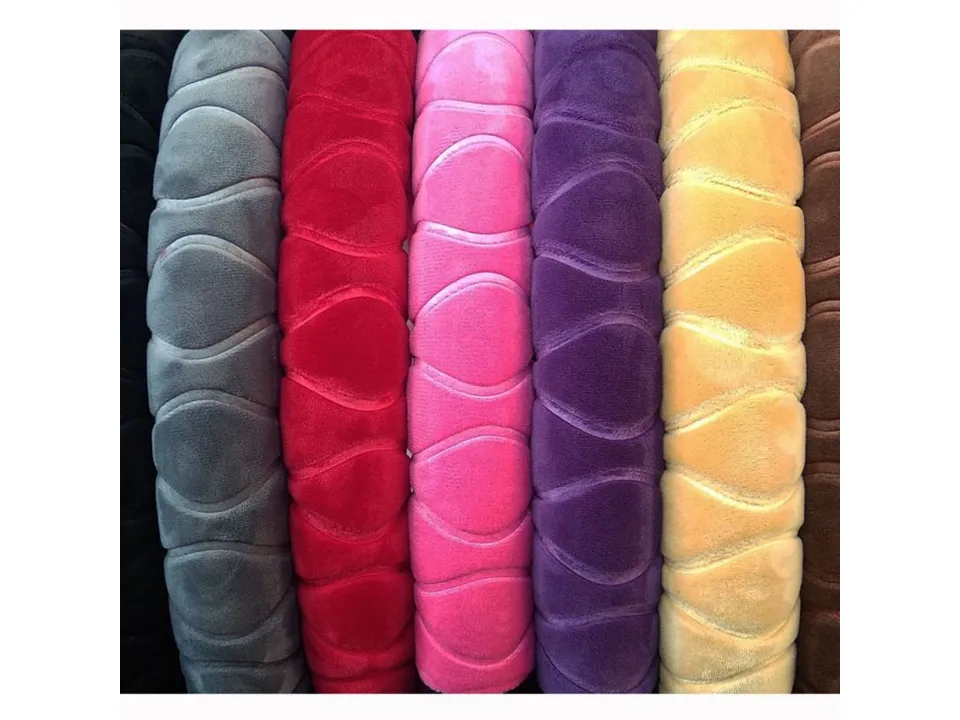 Close-up of plush steering wheel covers in various colors showing the texture.