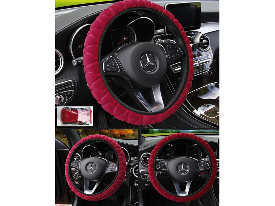 Red plush steering wheel cover installed on a car steering wheel.