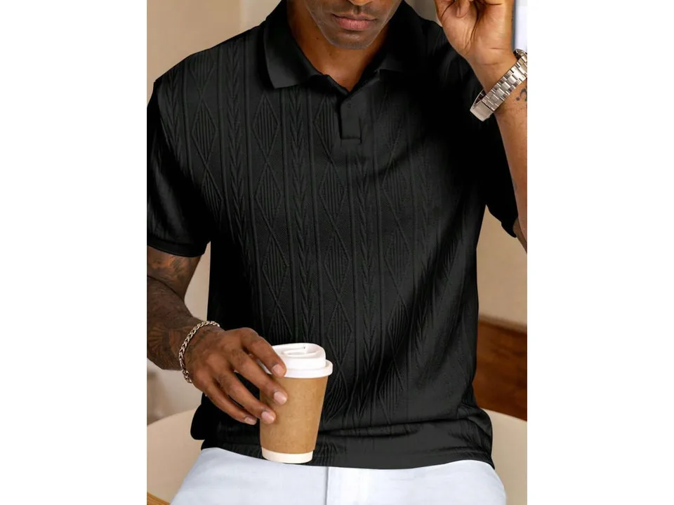 A man wearing a black short-sleeve jacquard knit polo shirt.