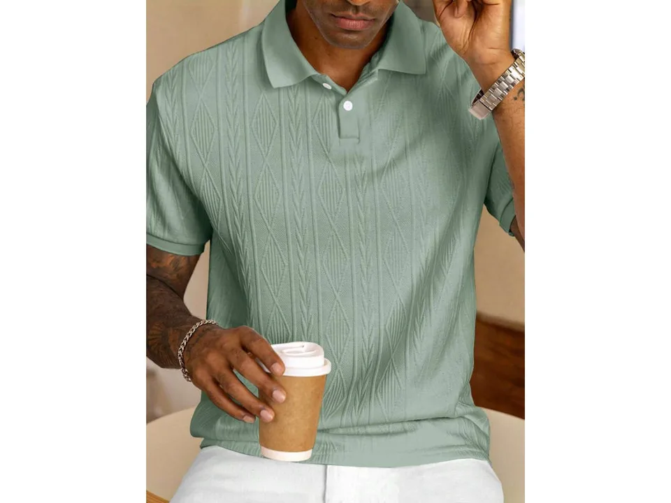 A man wearing a light green short-sleeve jacquard knit polo shirt.