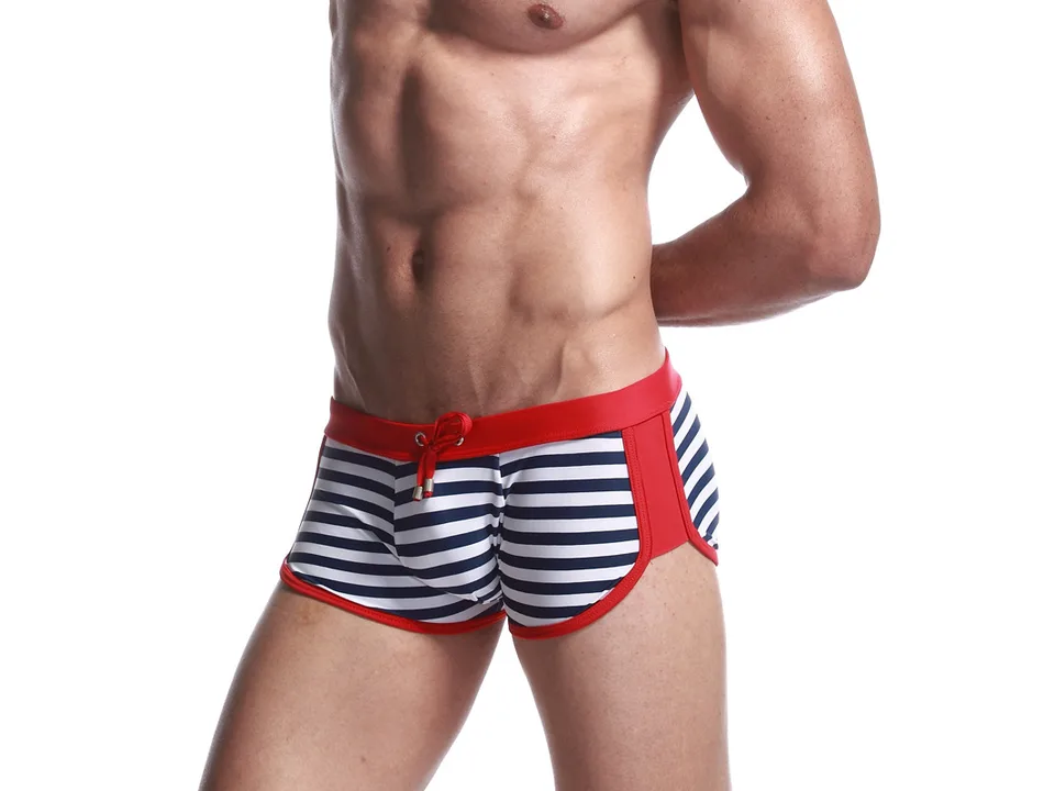 Side view of men's striped swim shorts with red side panels.