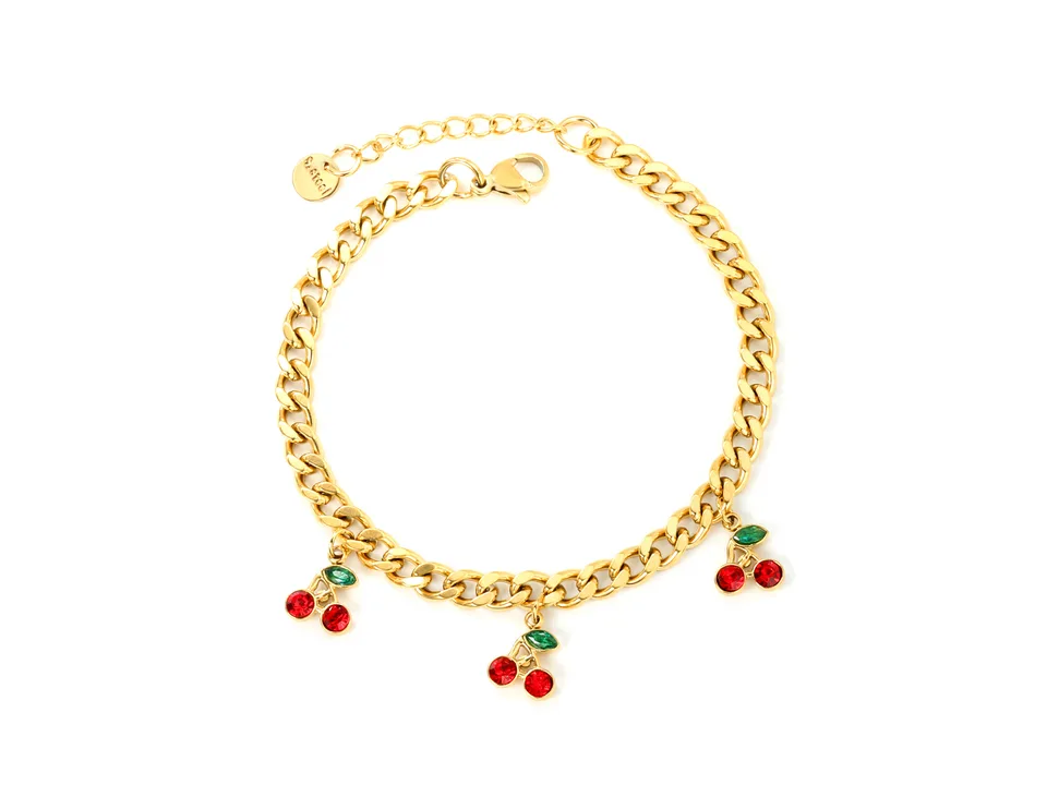 Gold-plated cherry charm bracelet on a plain white background.