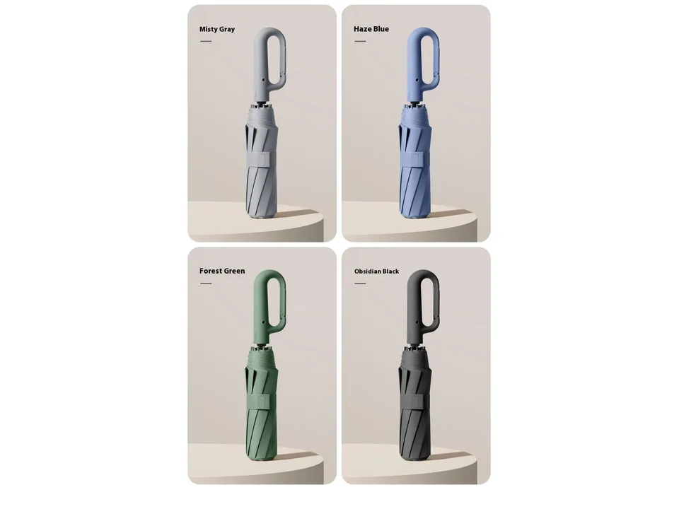 Four folded umbrellas in Misty Gray, Haze Blue, Forest Green, and Obsidian Black colors.