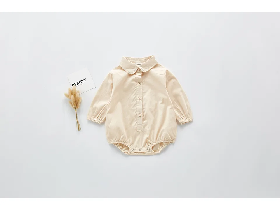 Beige long-sleeve baby bodysuit with a collar.