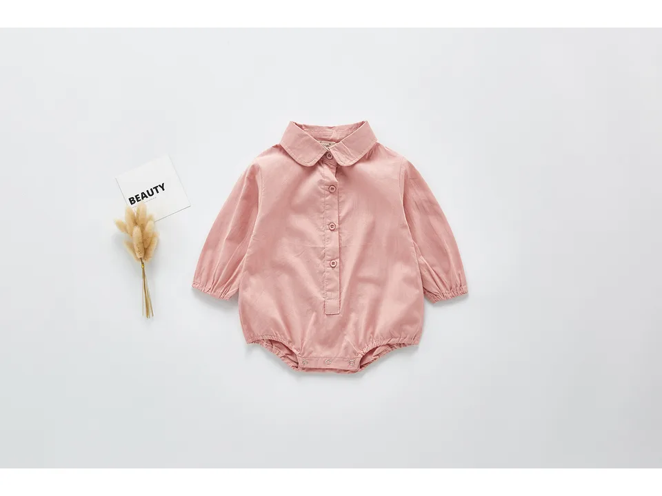 Pink long-sleeve baby bodysuit with a collar.