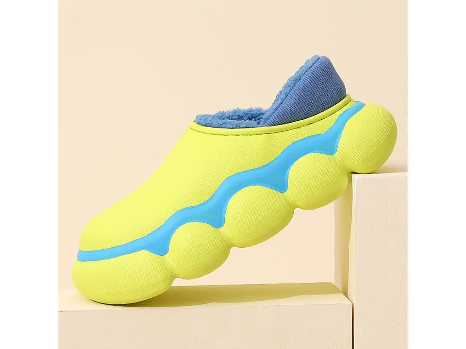 A lime green EVA clog slipper with a blue plush lining, shown from the side.