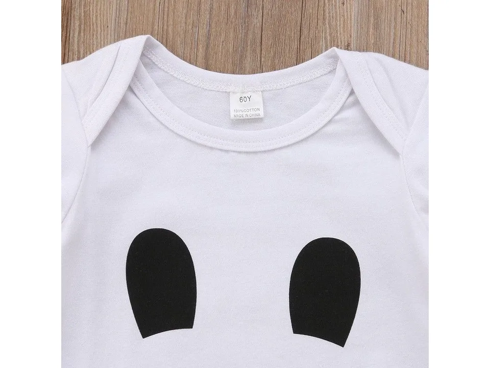 Close-up of the chest area of the white onesie with a black ghost face print.