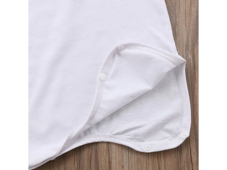 Close-up of the bottom of the white onesie showing the snap button closure.