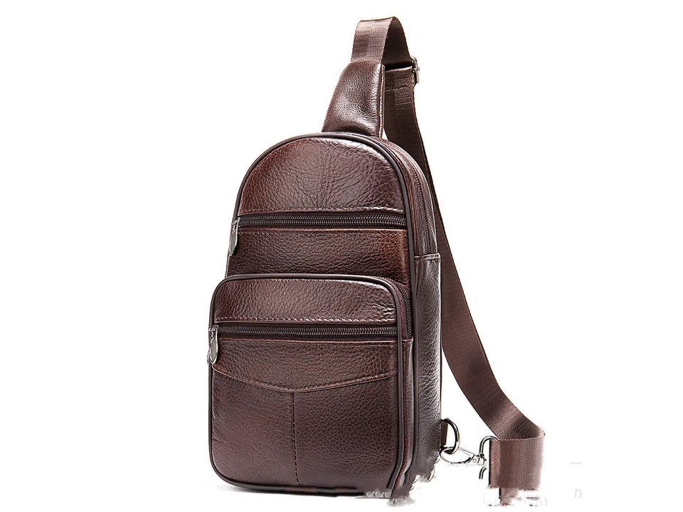 Front view of the brown leather chest bag with multiple zipper compartments.