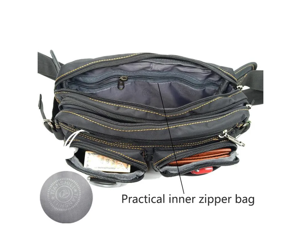 Open view of the black chest bag showing multiple zippered compartments and interior lining.