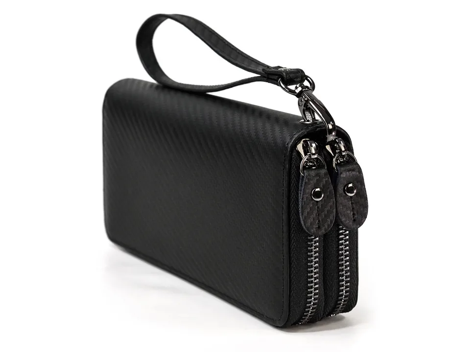 Black carbon fiber texture clutch bag with double zippers and a wrist strap.