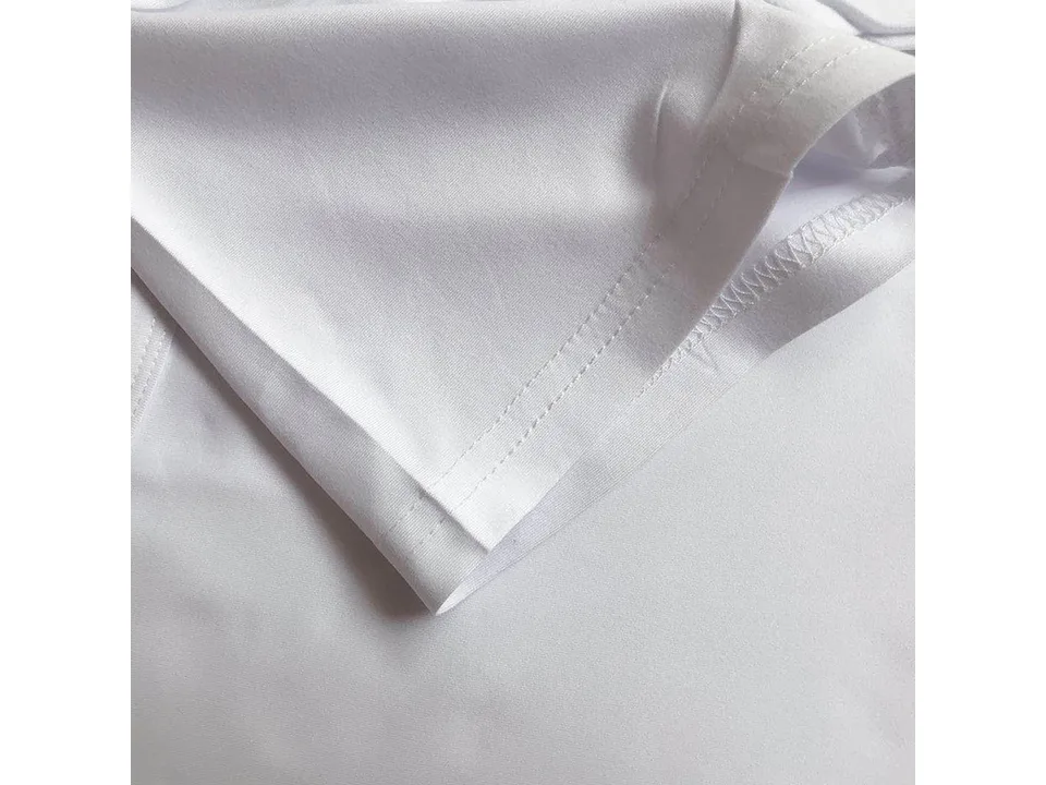 Close-up of the hem stitching on a white t-shirt