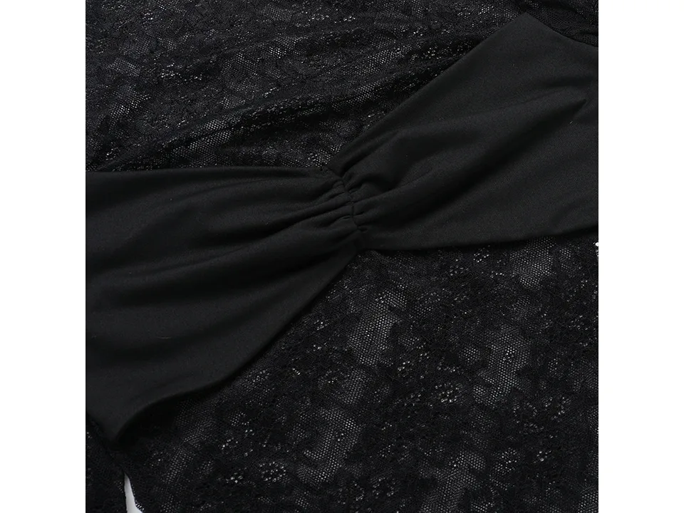 Close-up of the black lace fabric and gathered detail on the top.