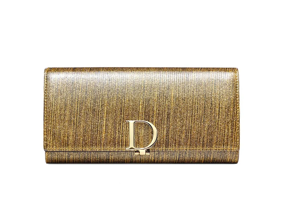 A glittery gold wallet with a gold D-shaped buckle closure.
