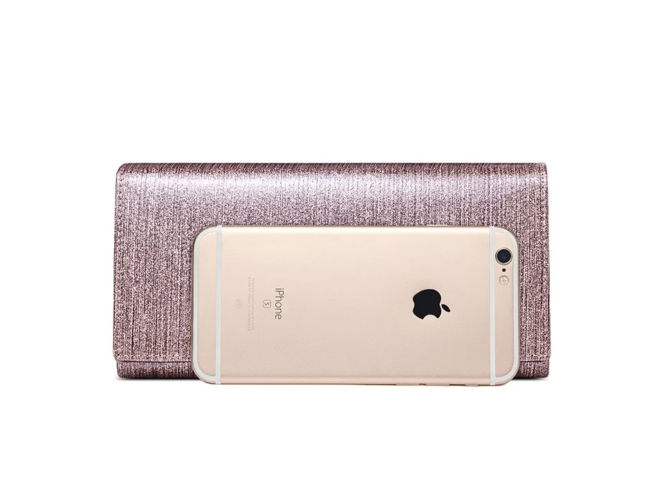 A glittery pink wallet with a smartphone placed on top for size reference.