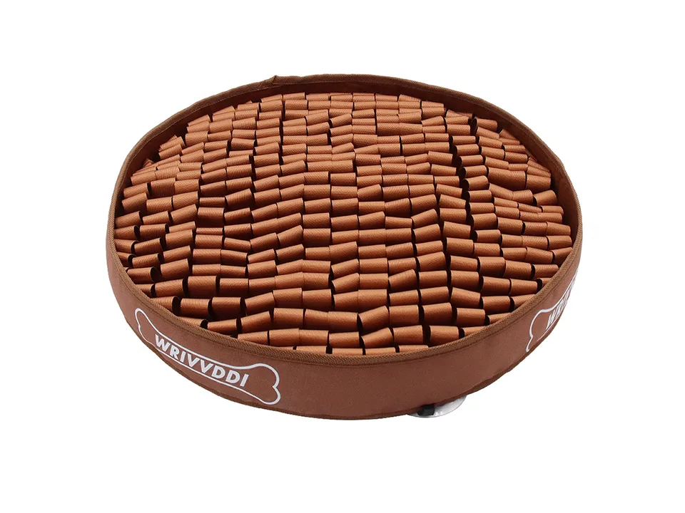 Brown round dog sniffing mat with fabric strips for puzzle feeding.