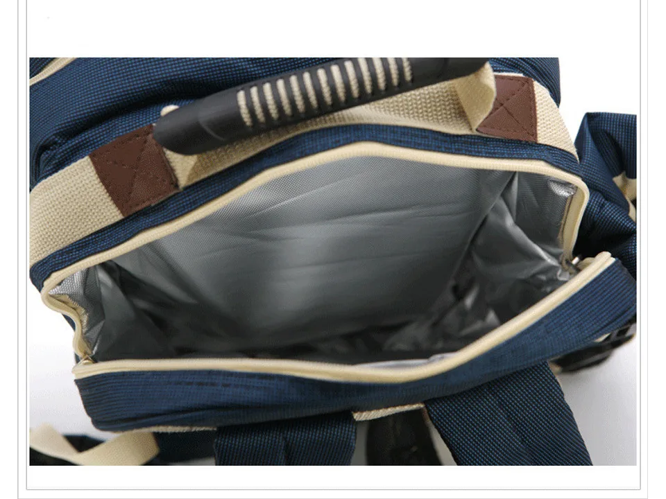 Open insulated compartment of the picnic backpack showing the silver thermal lining.