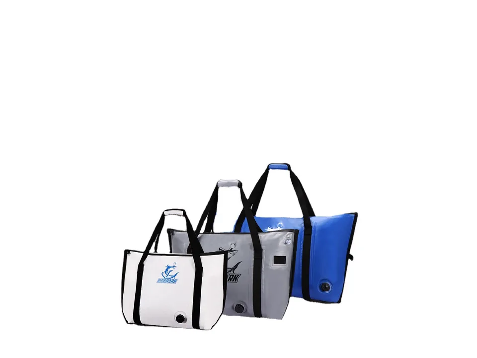 Three insulated cooler bags in white, grey, and blue standing upright.
