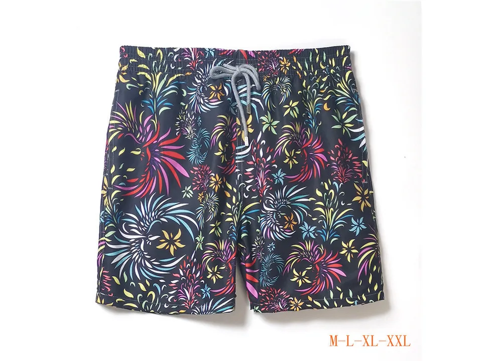 Dark navy board shorts with a colorful firework-style floral pattern.