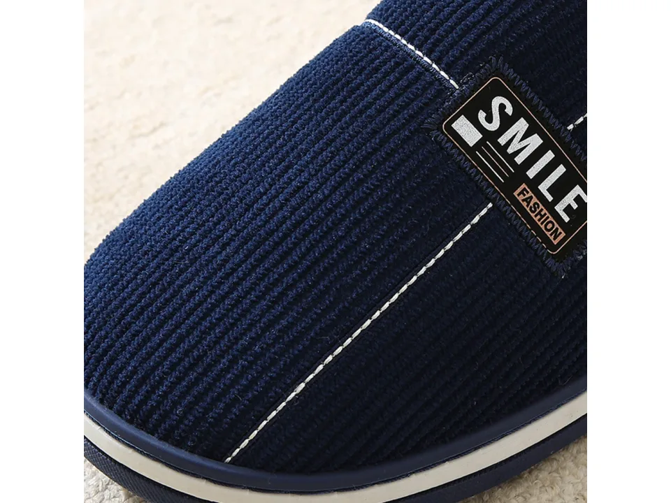 Close-up of the corduroy fabric and 'SMILE FASHION' label on the slipper.