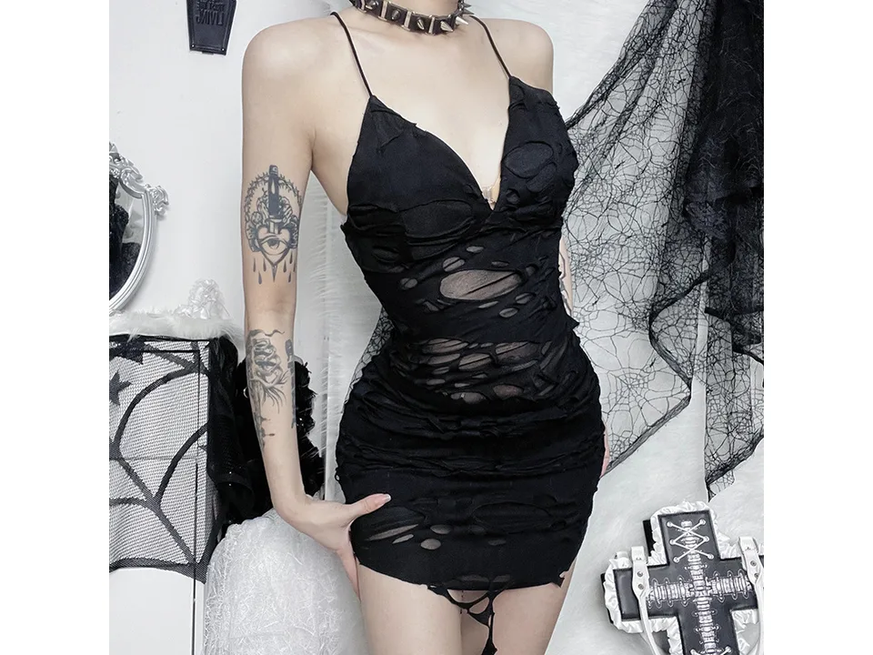 Model wearing a black distressed bodycon mini dress with spaghetti straps.