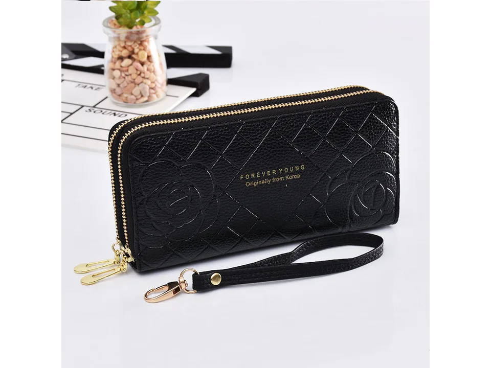 Black women's double zipper clutch wallet with floral pattern and wrist strap.