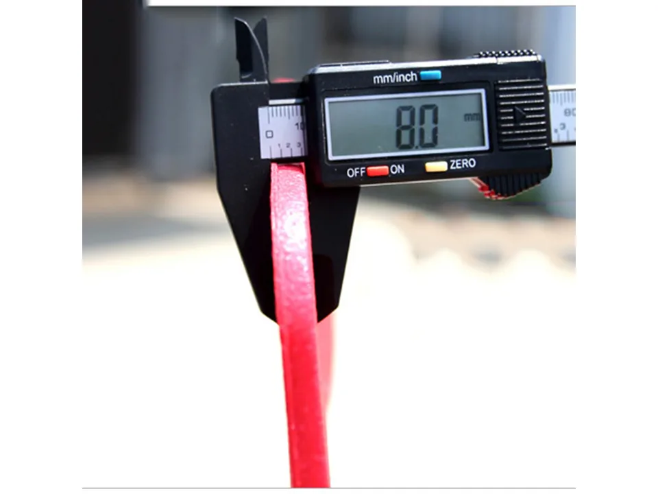 A digital caliper measuring the thickness of a red foam seat cushion, showing 8.0mm.