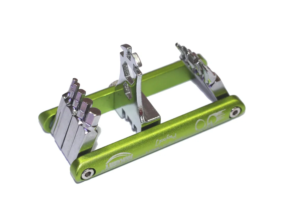 Green and silver folding bicycle multi-tool on a white background.
