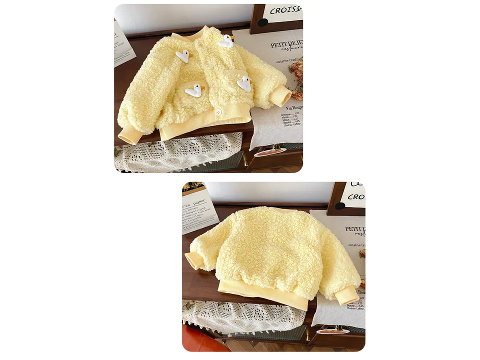Front view of the yellow fleece children's coat with duck appliques.
