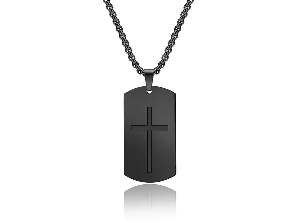 Black dog tag necklace with a cross cutout on a white background.