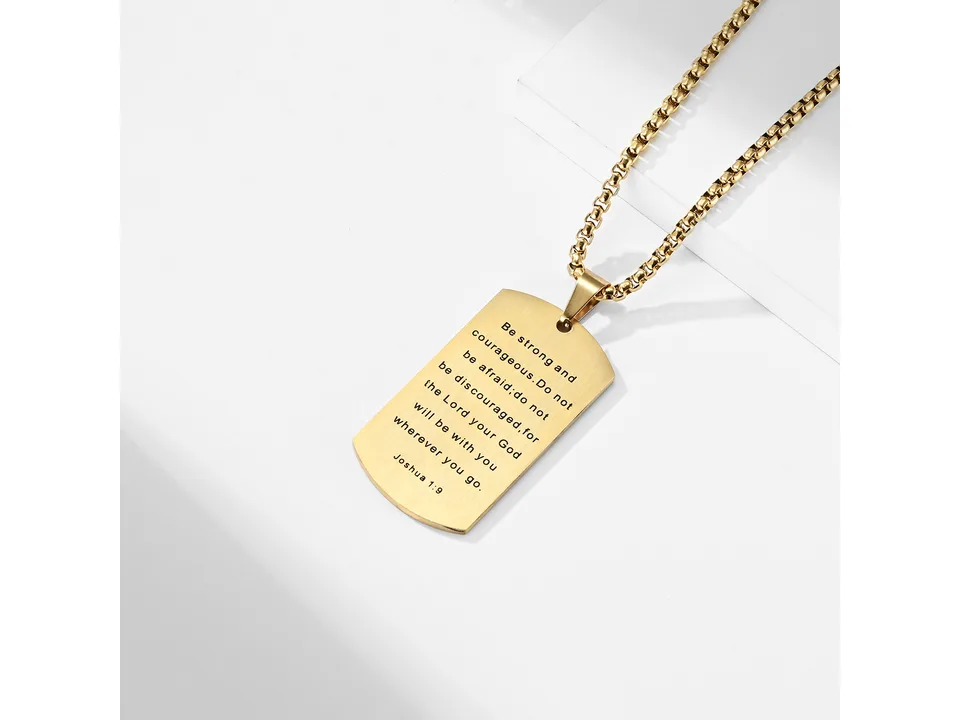 Gold dog tag necklace showing the engraved Joshua 1:9 verse on the back.