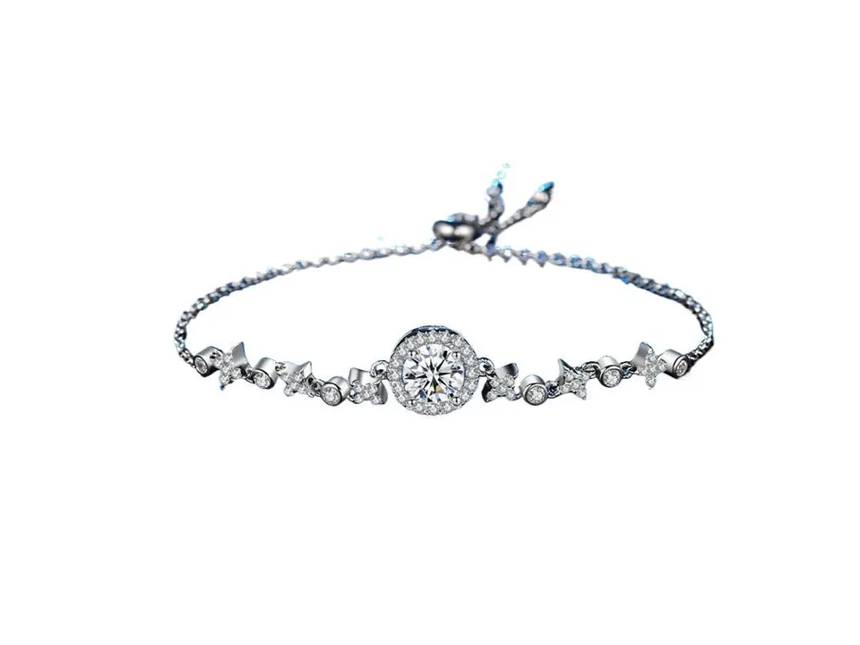 Full view of the silver moissanite bracelet with a central round stone and star-shaped accents.