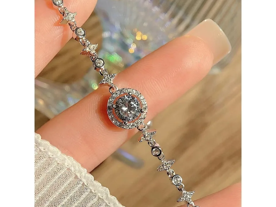 A close-up view of the moissanite bracelet being worn on a wrist.